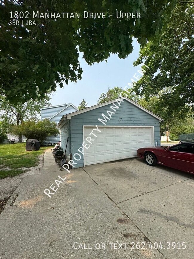Building Photo - 1802 Manhattan Dr