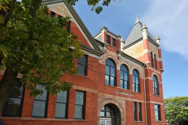 The Roosevelt School was built in 1888 and first used as Clinton's high school. - Roosevelt School Apartments