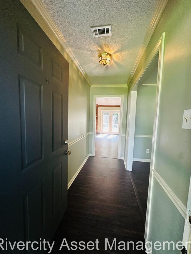 Building Photo - charming three-bedroom, two-full-bath resi...