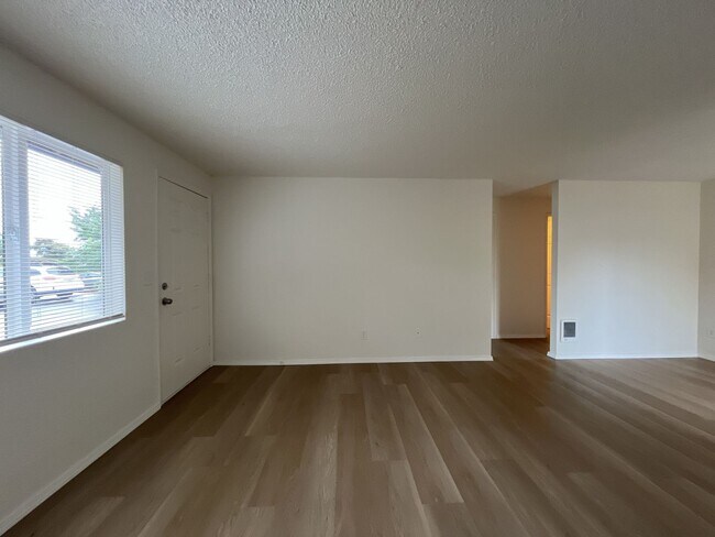 Building Photo - Inviting 2 Bedroom Home with Open Layout, Stainless Steel Appliances & Private Outdoor Retreat
