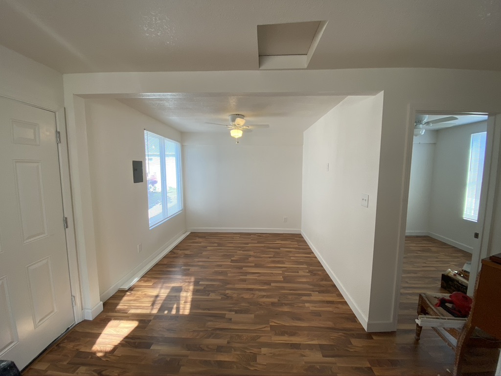 Picture of living room and on the right is the door to the bedroom - 216 1/2 cherry st