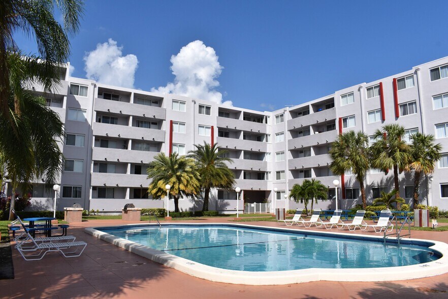 Relax in our Pool Area - Suncoast Place Apartments