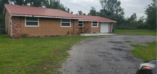 Building Photo - 5620 Sabal Palm Ln