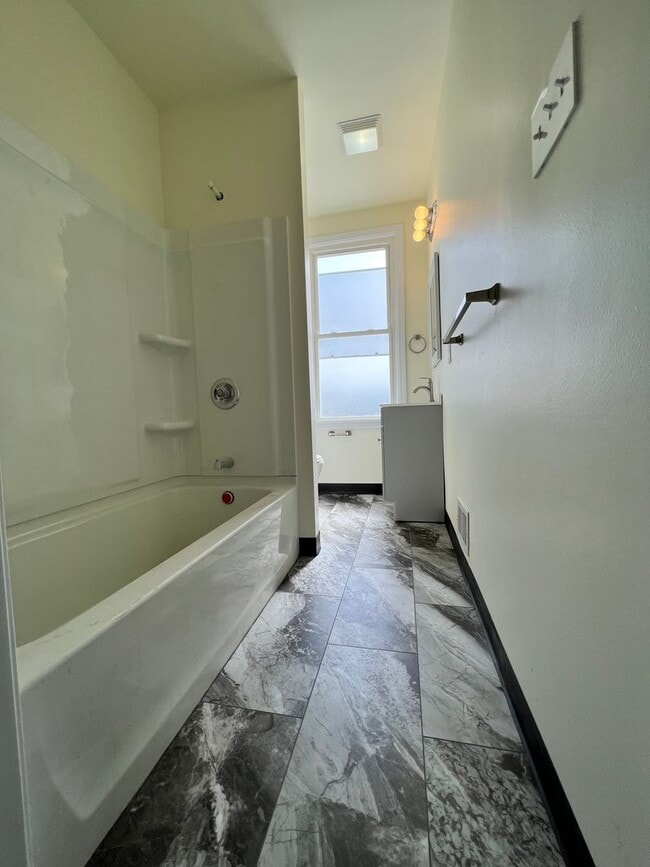 Building Photo - Updated 3BR house with multi-car off street parking!