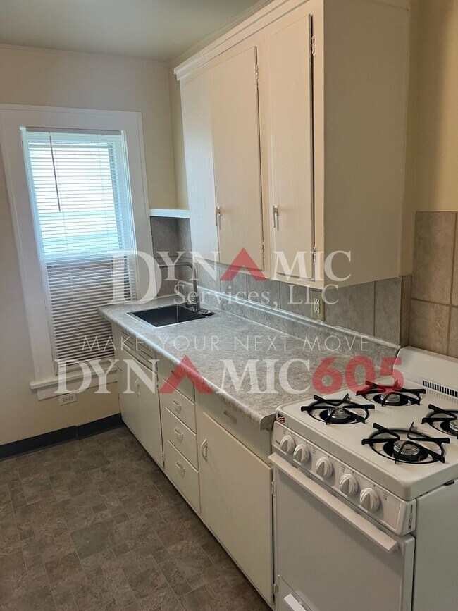 Building Photo - Studio with Bathroom - All Utilities Paid ...