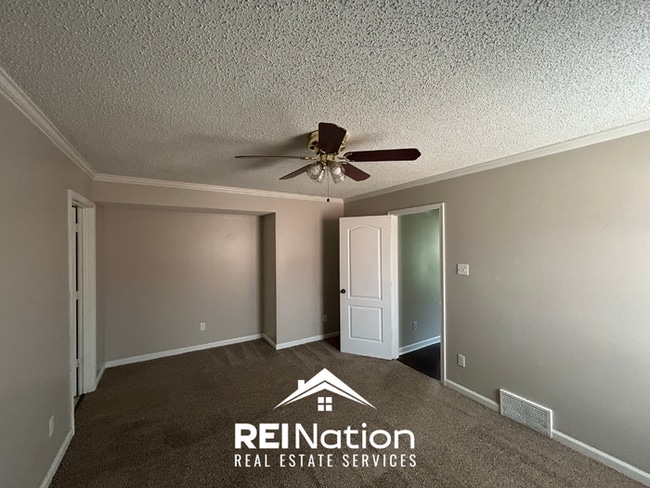 Building Photo - Spacious 4BR/2BA Near Southwind | High Ceilings, Brick Fireplace & 2-Car Garage