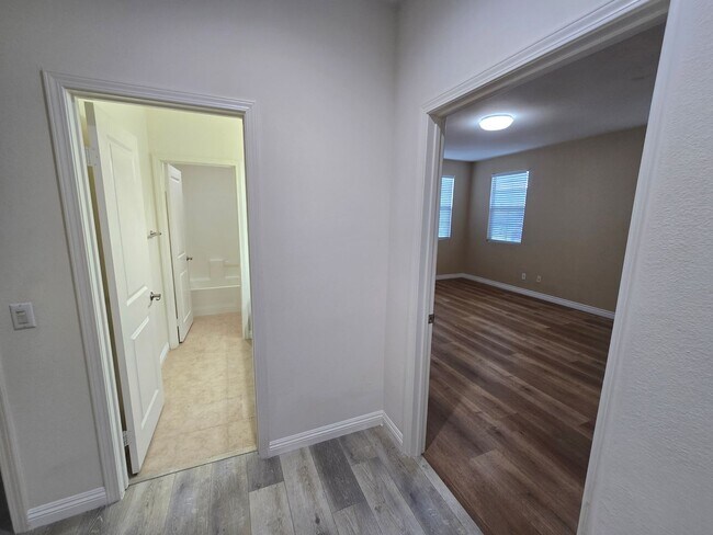 Building Photo - Open-Concept Living with Downstairs Bedroom & Enclosed Patio Retreat