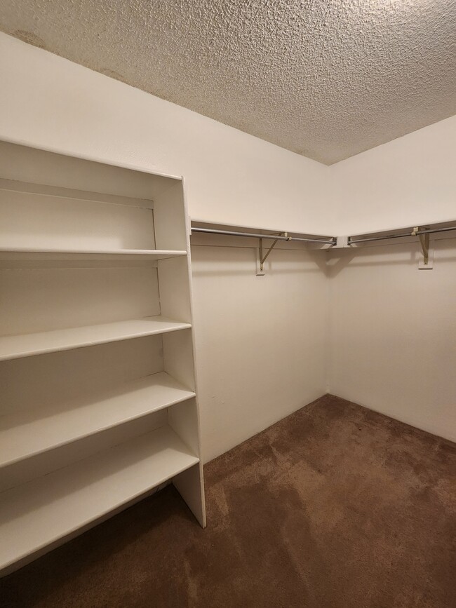 Primary Bedroom Walk-in Closet - 4896 S Dudley St