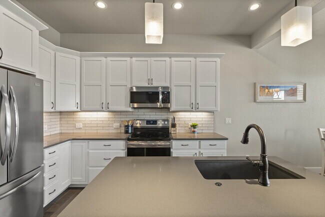 Building Photo - Stunning 3 bed, 4 bath townhome - attached...