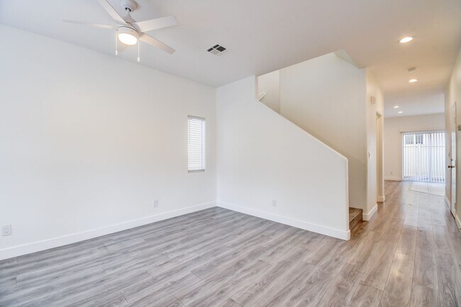 Building Photo - Great home with 4 bedrooms, 2.5 baths. New Floors Paint and Countertops.