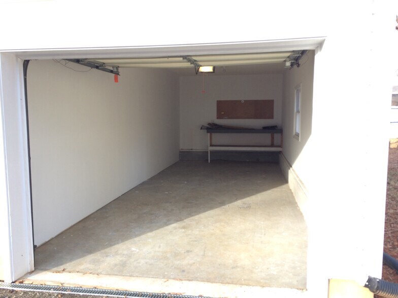 Private 1.5 car garage with work bench and electric garage door opener - 361 W Wilson Ave