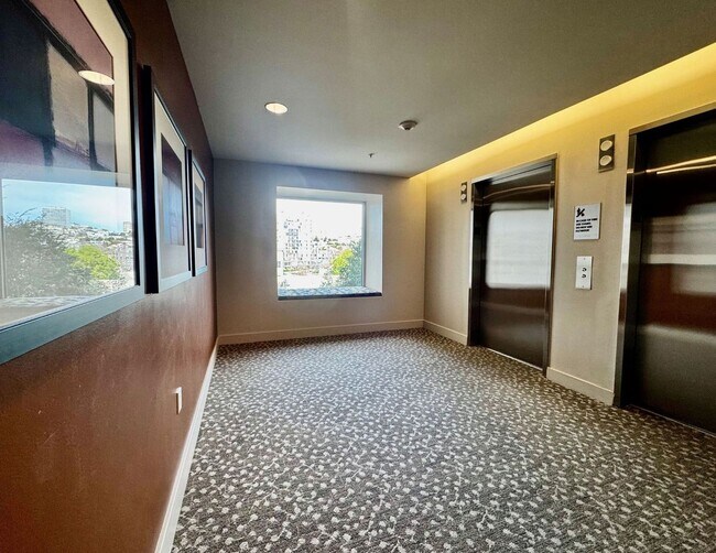 Building Photo - Corner Light. City Energy. Zero Compromise.