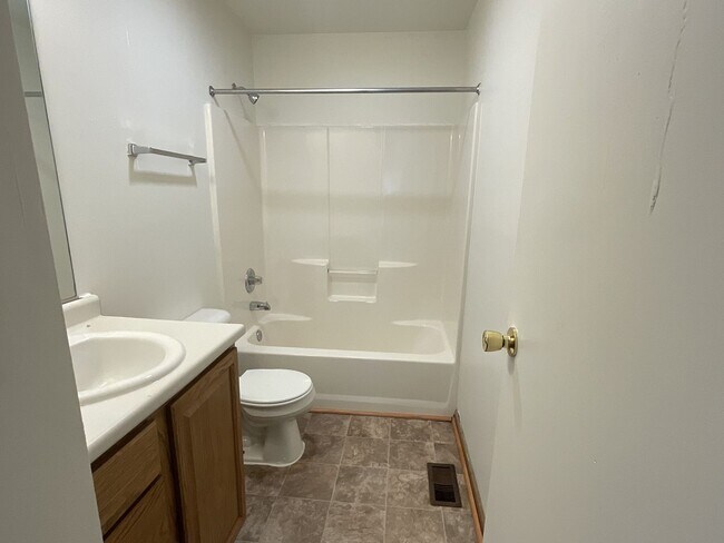 Building Photo - For Rent - 4 Bedroom, 2 Full Bath Home with Ground-Floor Bedroom, Attached Garage and Brand-New K...