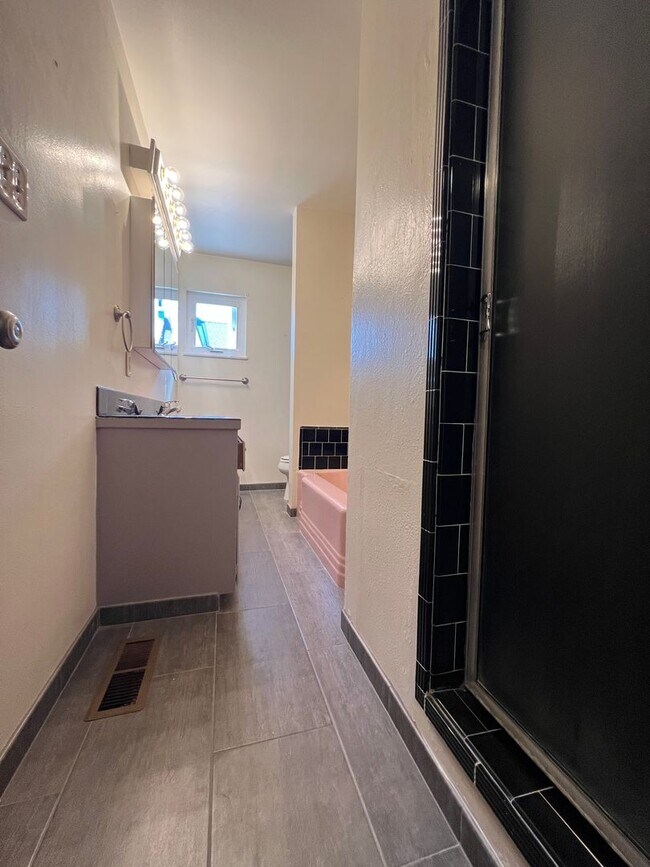 Building Photo - Spacious 4-Bedroom Retreat Just Steps from...