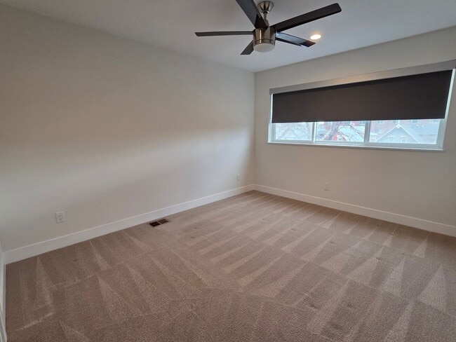 Building Photo - STUNNING 4-LEVEL TOWNHOME IN HIGHLANDS WITH SAUNA, 2-CAR GARAGE + AMAZING ROOFTOP DECK!