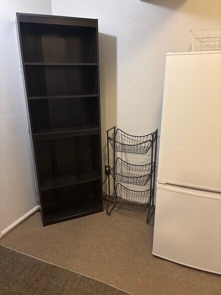 Hallway and fridge - 3740 E 99th Way
