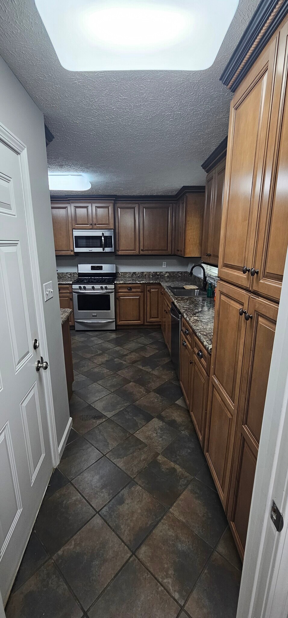 Entry from garage - 901 Hurst Dr