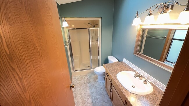 Building Photo - 4bd/3ba HUGE Home w/Hardwood Floors, Russian Fireplace, 2-Car Garage & Fenced Back Yard!