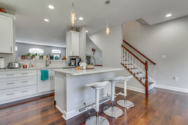 Building Photo - Belmont Bay Beauty! Three level two car ga...