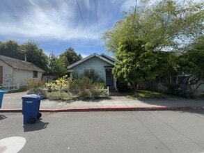 Building Photo - Sit out with your pet on the patio of this...