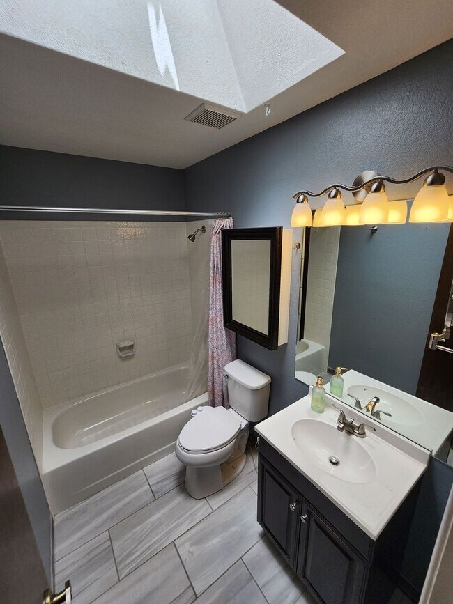 Building Photo - Spacious 4-Bedroom Home with RV Parking in...