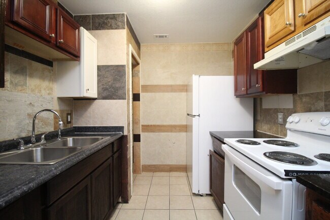 Building Photo - Updated 2BR/1BA Brick Duplex in North Pensacola with Tile Flooring Throughout, Included Utilities...
