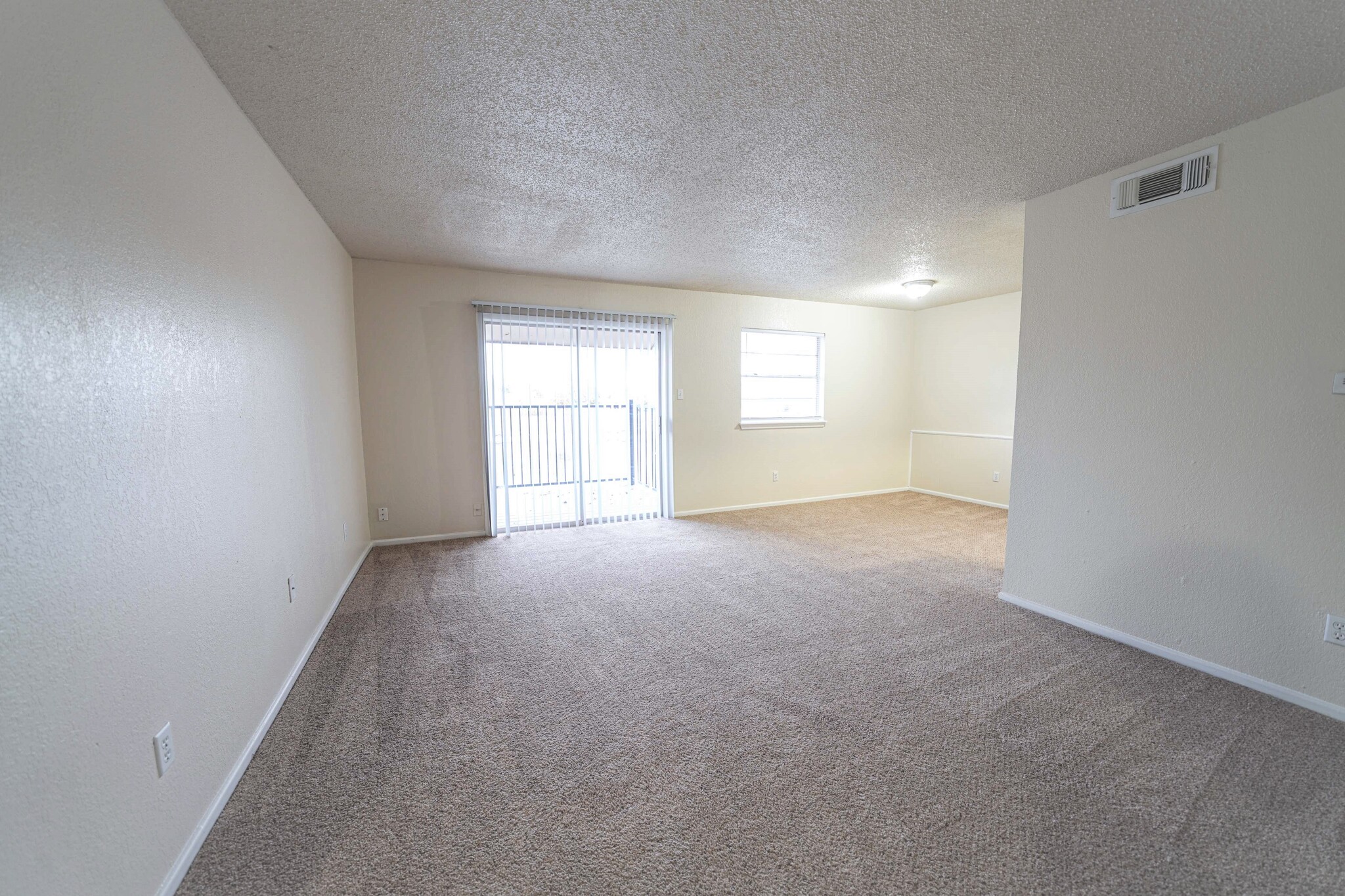 Living Room and Balcony - Waterside Village LLC