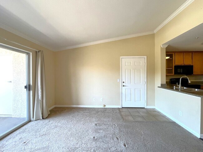 Building Photo - 1BR Condo with Private Balcony, Central A/C & Community Amenities in Corona