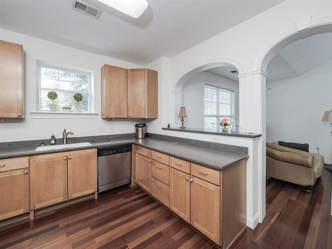 Building Photo - Spacious top-floor condo — 2BR/2BA with hardwood floors, electric fireplace & deposit-free move-i...