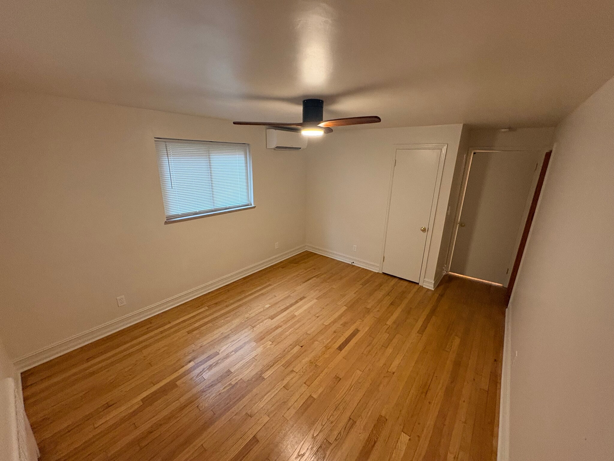 Primary bedroom with walk-in cedar closet area - 6035 Oakwood Ave