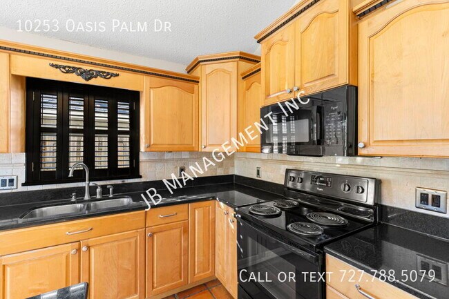 Building Photo - 10253 Oasis Palm Dr
