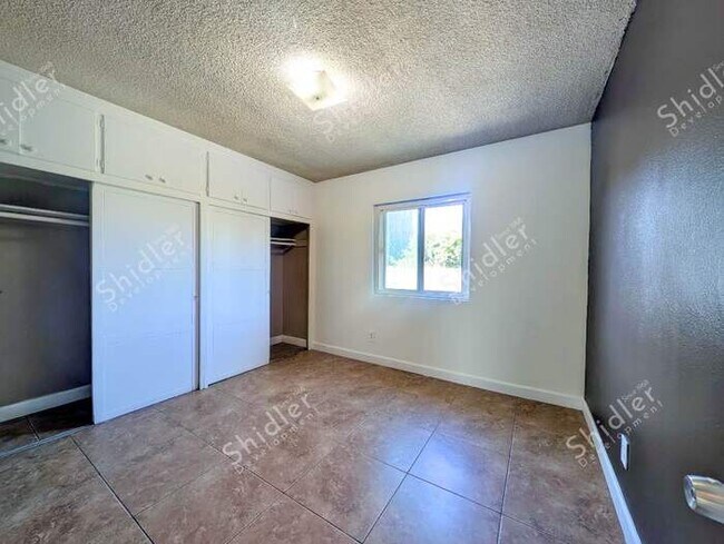 Building Photo - Upstairs 2 Bedroom 1 Bath with Massive Walk In Closet, Covered Gated Parking