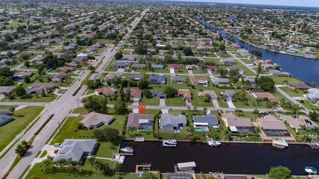 Building Photo - Gulf Access Pool Home. 4BED/2BATH. SE OF CAPE CORAL FL. Special Offer! Qualify for a deposit-free...