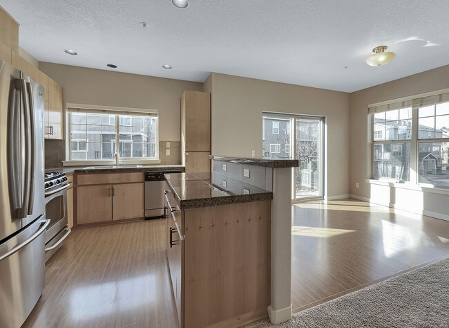 Building Photo - 2BR + 2.1BA Corner Townhome-Style Condo — Dual Primary Suites, Attached Garage & Most Utilities I...