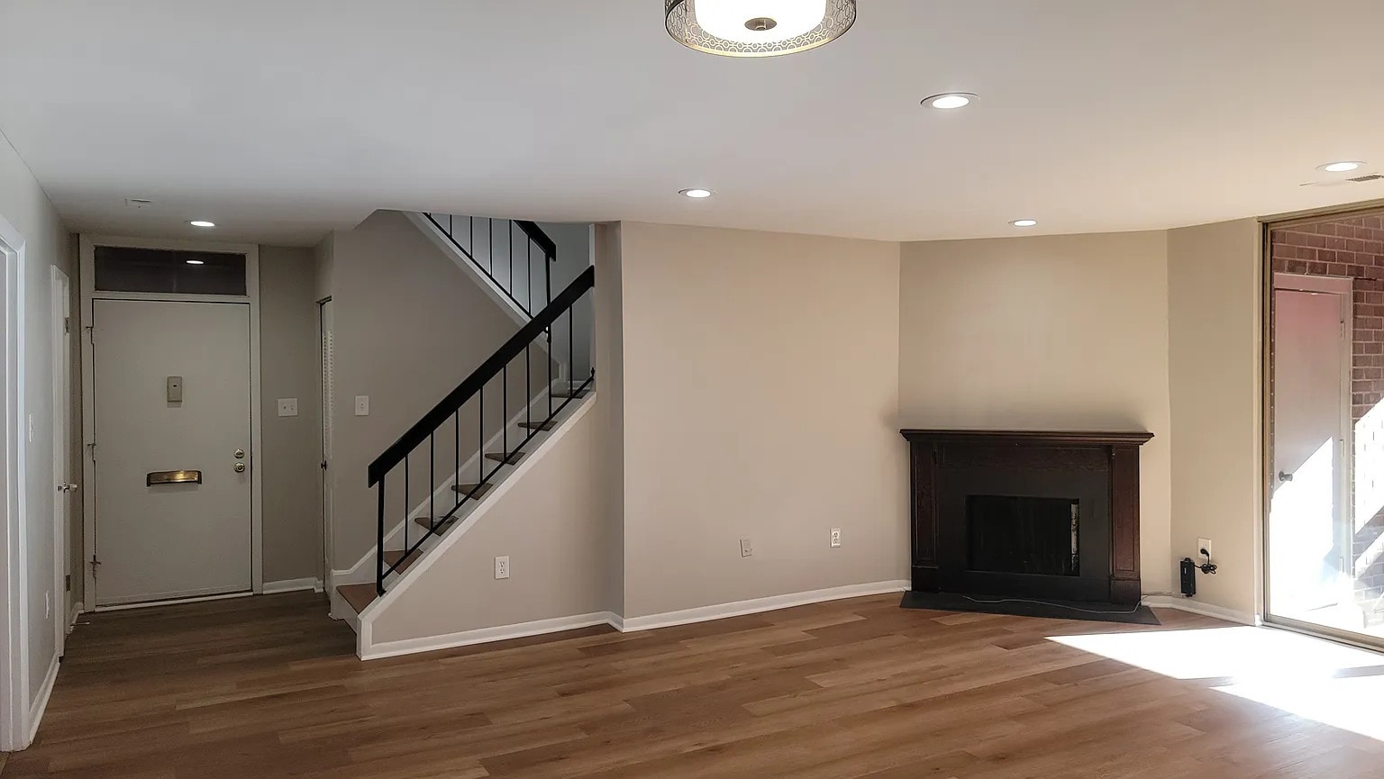 Entryway, stairs, and fireplace - 648 15th St S
