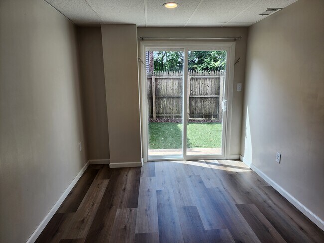 Bedroom 2 with new sliding door, new hardwood floor, LED lighting - 100 Manning Pl