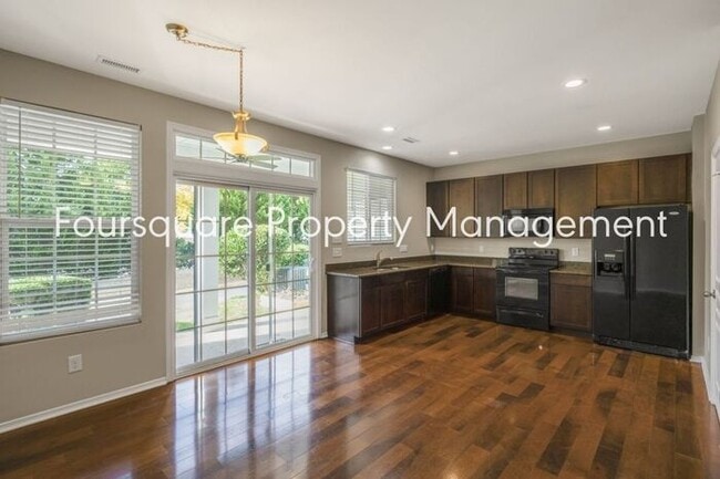 Building Photo - Charming Townhome with Open Layout, Back Patio & One-Car Garage – Near RTP, RDU & Everyday Conven...