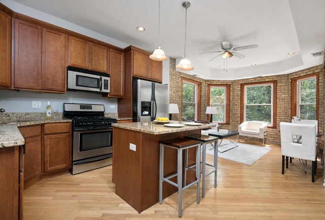 open-concept living room and kitchen - 1332 W Greenleaf Ave
