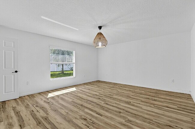 Building Photo - Modern 4-Bedroom, 3-Bath Home with Private In-Law Suite – Palm Coast, FL