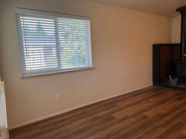 Building Photo - Charming Redding Home with Fireplace & Vau...
