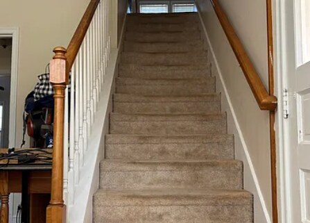Utility room (downstairs) with stairs leading to upper level - 207 Edgedale Dr