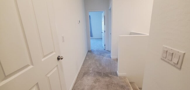 Building Photo - Beautiful townhome features a bright, open-concept layout