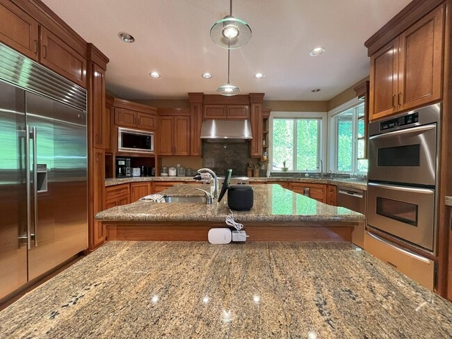 Building Photo - Forest-View Luxury Home with 5 Bedrooms, Luxury Primary Suite & Gourmet Kitchen