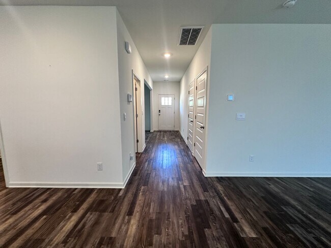 Building Photo - efficient two-level home provides a large living room, 4 very spacious bedrooms, and 2.5 bathrooms