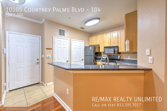 Building Photo - 10105 Courtney Palms Blvd