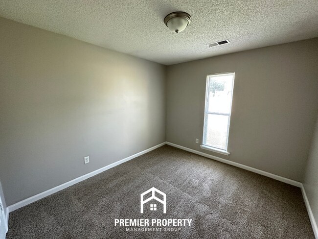 Building Photo - Charming 3BR/2BA Near Southwind | High Vaulted Ceilings, Hardwood Floors & Fireplace