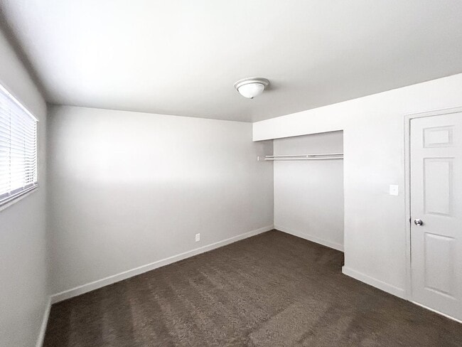 Building Photo - Spacious 5-Bedroom Home with Lofted Garage