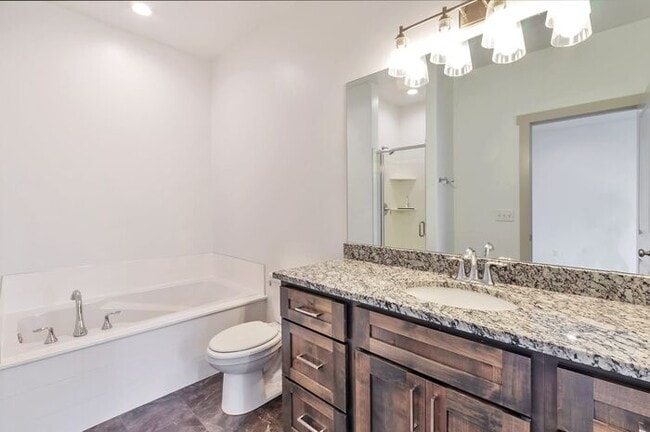 Building Photo - Modern End Unit townhouse w attached 2 car...