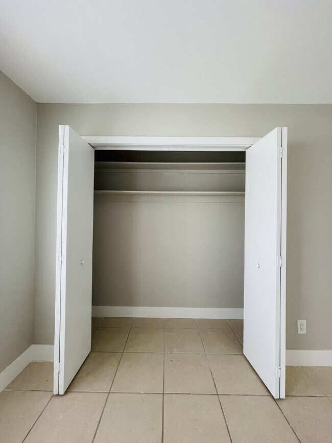 Building Photo - Updated 2-bedroom waterfront duplex with walk-in closets, enclosed Florida room, and canal views ...