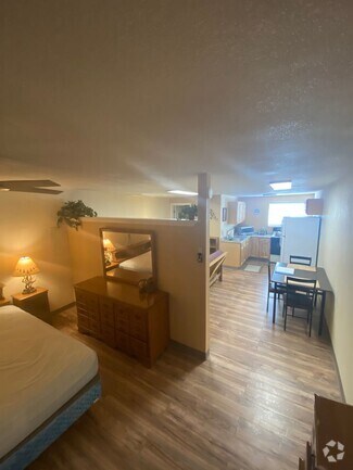 Building Photo - Adorable studio with large garage and work...